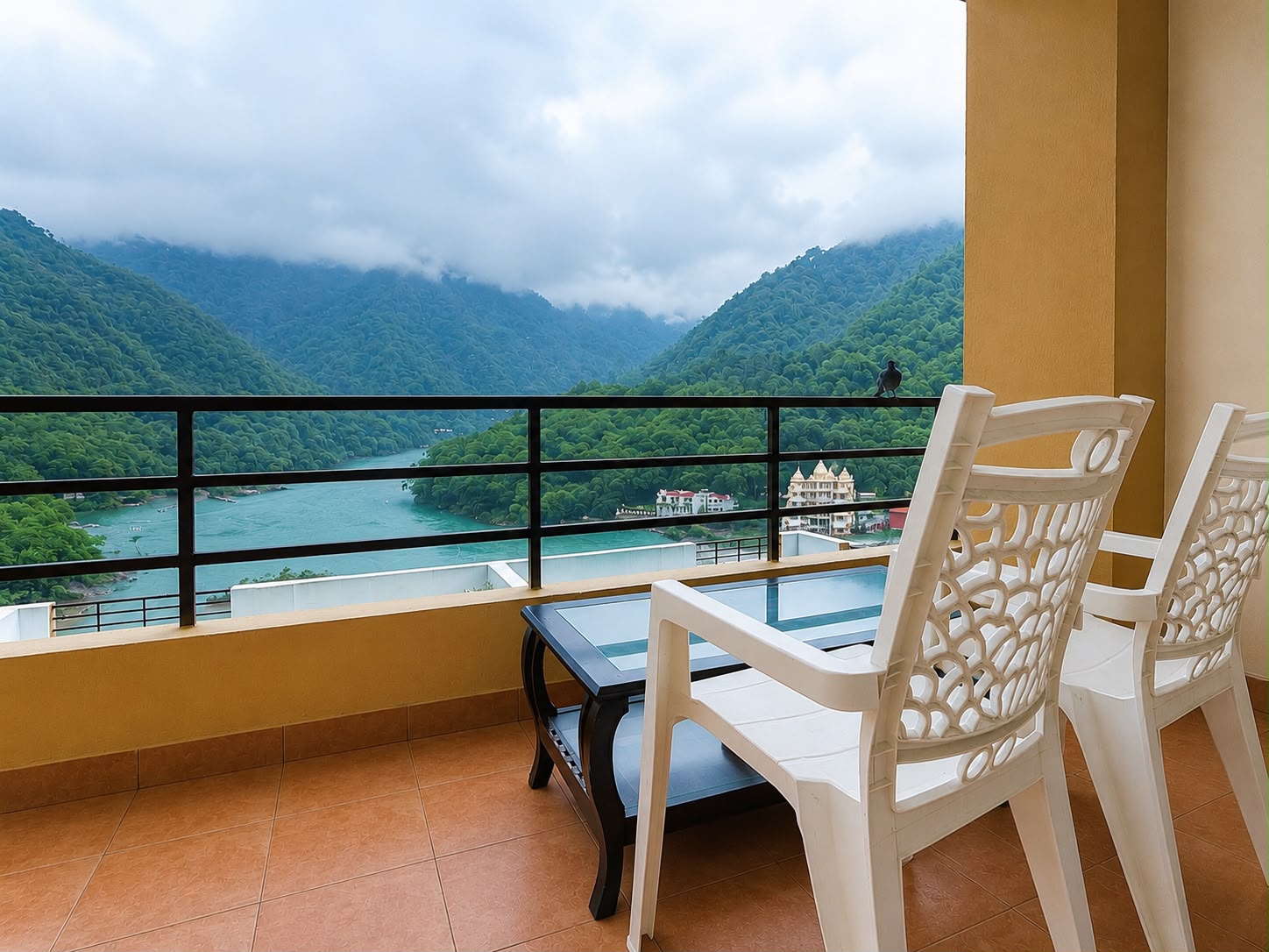 Balcony seating overlooking the Ganga at Aloha Oasis