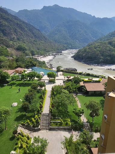 Resort pool, gardens and river valley view