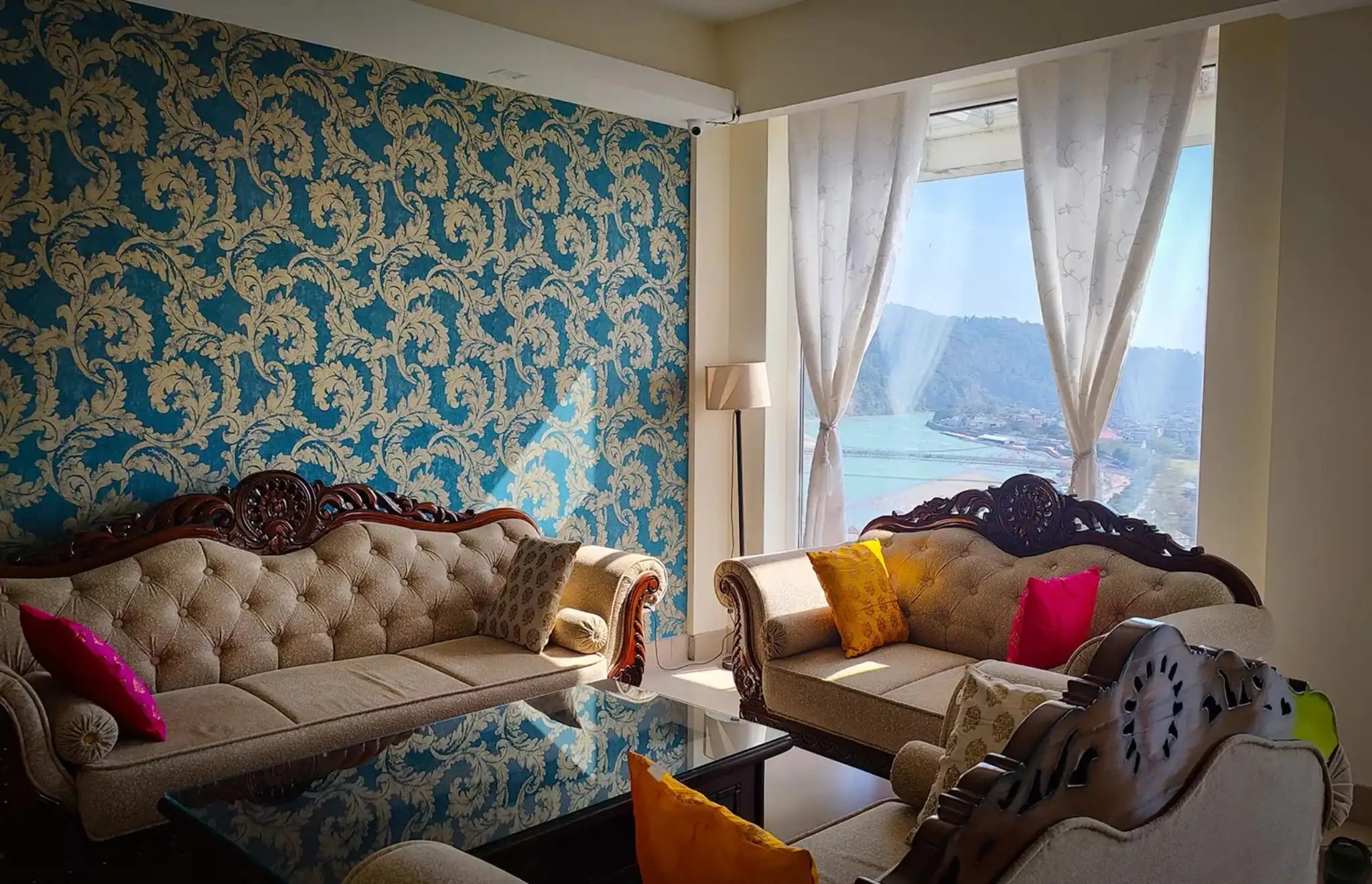 Sofas facing the river at Ganges Heaven
